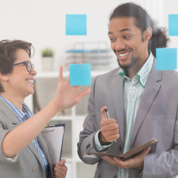 Two coworkers are designing the B2B marketing strategies for LATAM